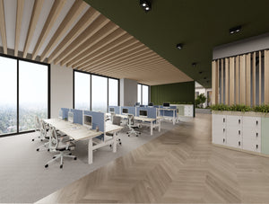 Levo Sit Stand Bench Desks with Blue Join Desk Screens with White Galen Office Chair with 5 Star Base with Castors and Uno Lockers with Planters in Modern Office Setting