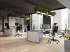 Levo Sit Stand Desks in Grey and White Finish with Contour Ergonomic Chair and Key Side Storage in Modern Office Setting 2