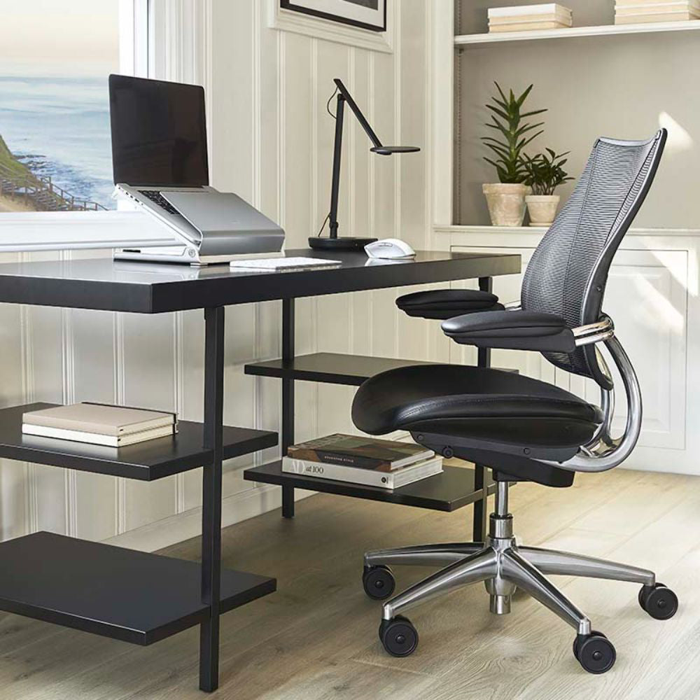 Liberty Ocean Ergonomic Office Armchair in Black Finish with Indoor Plant and High Table in Office Setting