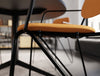 Line Canteen Chair Seat Detail in Upholstered Orange Finish with Black Steel Frame