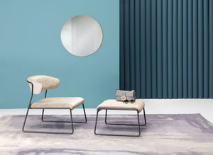 Lisa Lounge Armchair With Pouffe And Wall Mirror In Studio Setting