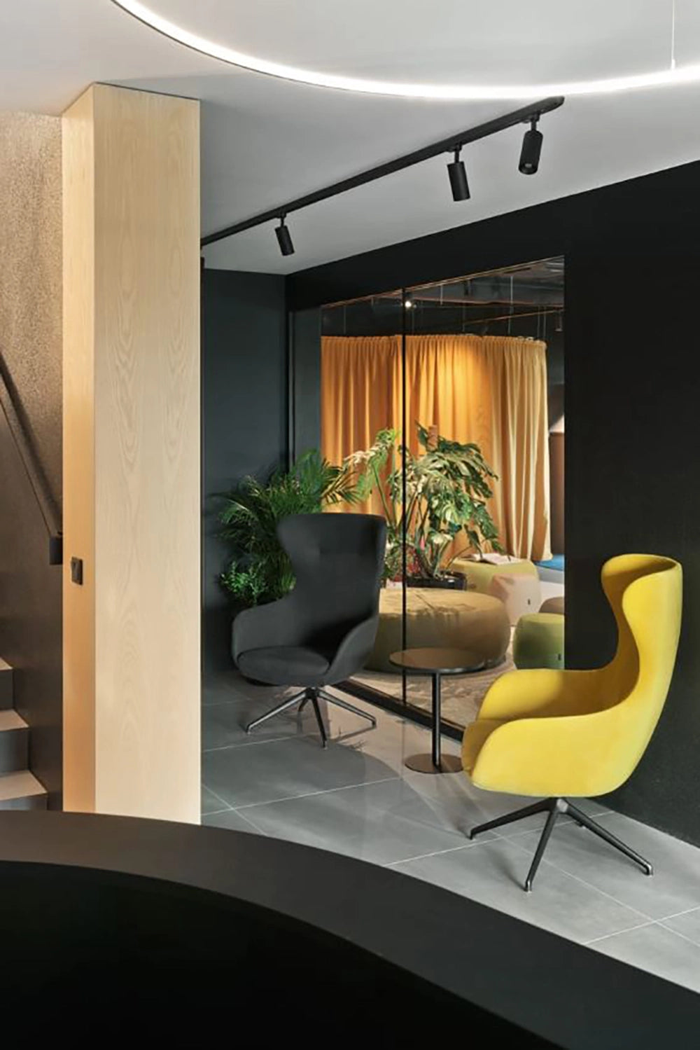 Loop Upholstered Lounge Armchair In Yellow Finish With Black Round Top Coffee Table In Breakout Setting