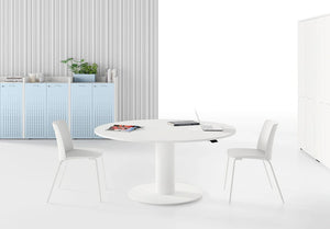Mara Follow Round Adjustable Table 299K In White Top Finish And White Chair In Living Room Setting