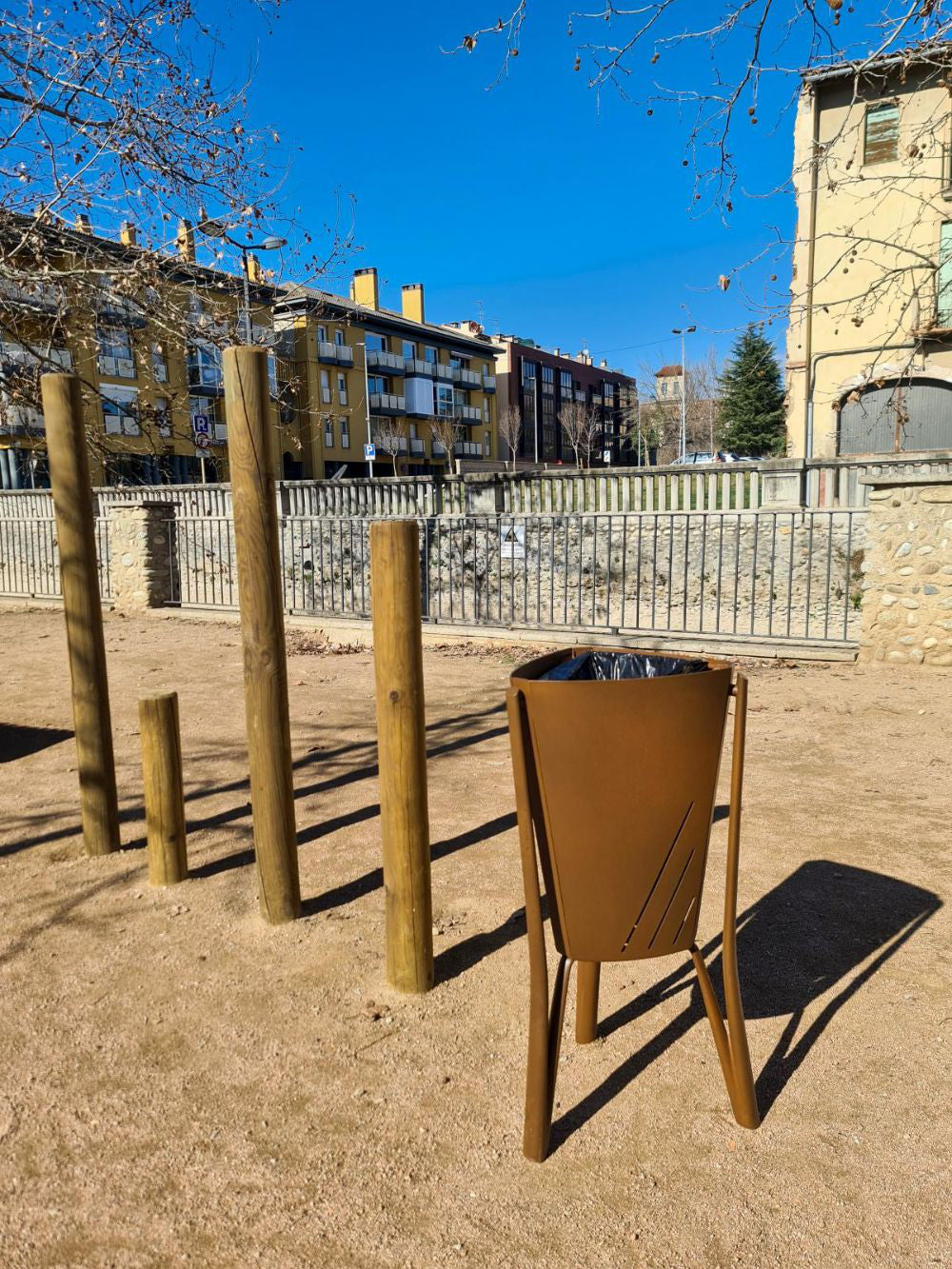 Minsk Outdoor Waste Bin in Brown Finish Outdoor Setting 3