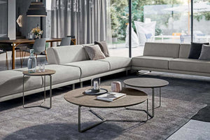 Montreal Side Round Table With Grey Sofa In Living Room Area