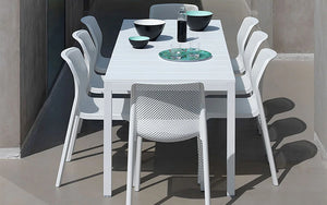 Nardi Bit Stackable Chair in White with White Table in Outdoor Settings