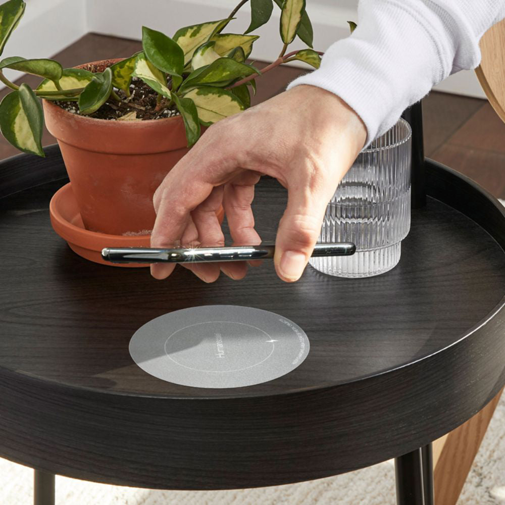 Neatcharge Wireless Charger Attached On The Table With Phone And Indoor Plant In Office Setting