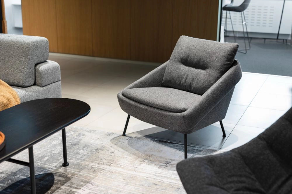 Nome Loose Backrest Lounge Chair in Grey with Grey Sofa and Oval Shaped Low Table