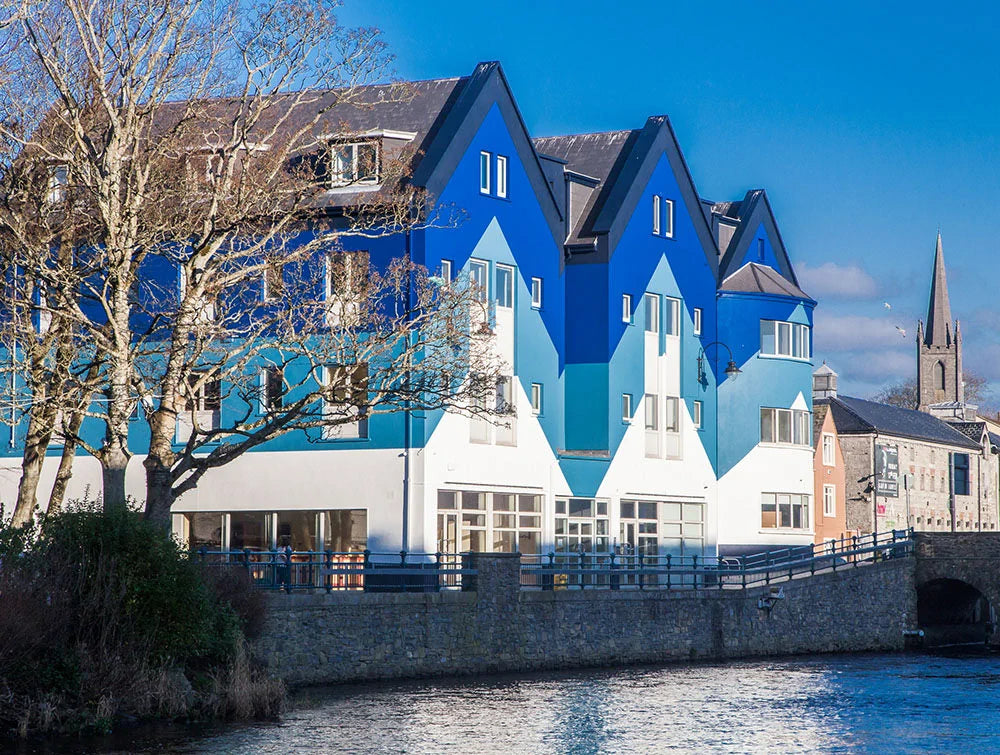Outdoor Shot Of The Building Block With River In Foreground