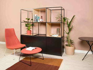 Palisades Metal Grid Built In Cabinet Bookcase Shelves With Lounge Red Chair And Small Round Table