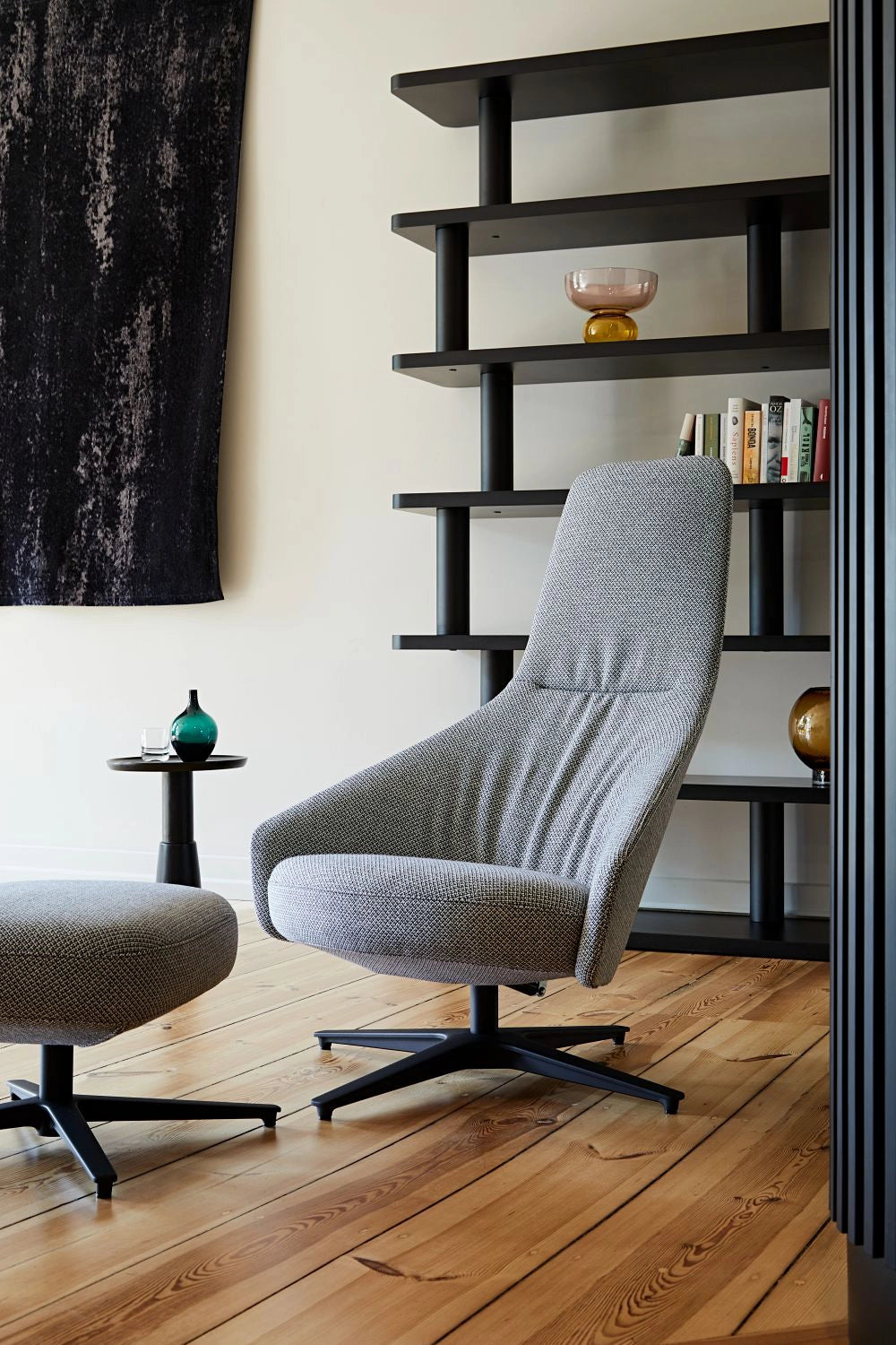 Palo Lounge Armchair with Wooden Legs in Light Grey Finish with Matching Footstool and Black Shelving Unit