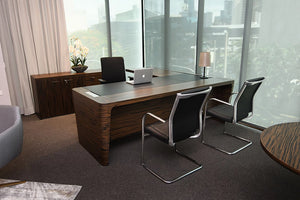 Quadrifoglio X10 Executive Desk In Ebony Finish With Stackable Chair And Table Lamp In Office Setting