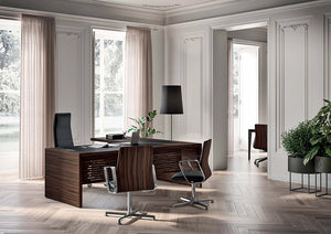 Quadrifoglio E 10 Executive Desk In Ebony Finish With Black Boardroom Chair And Black Standing Lamp In Office Setting
