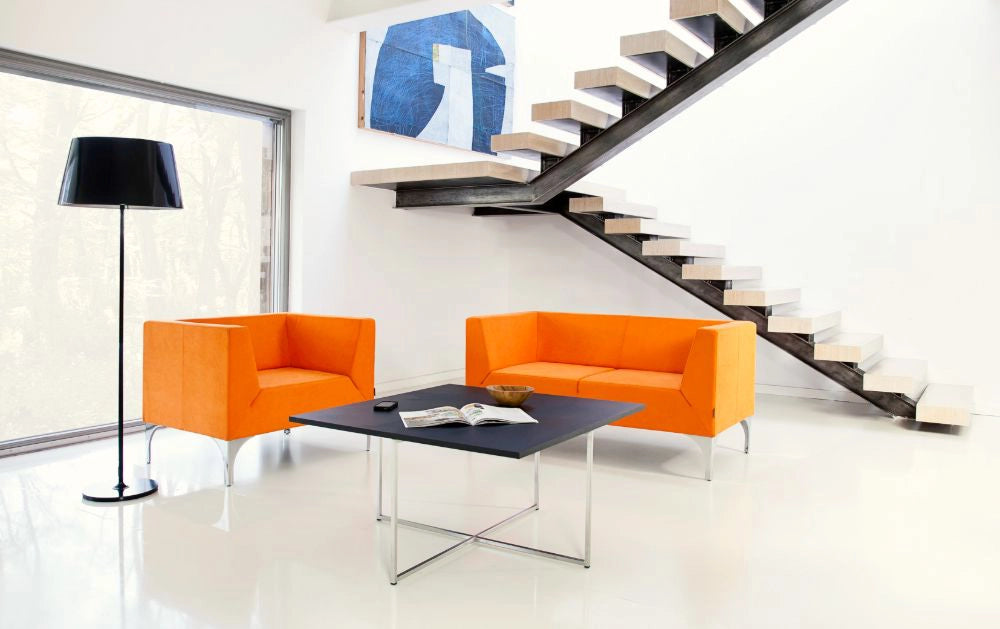 Quick Square Reception Table in Black Top and Stainless Steel Base with Orange Sofa and Armchair in Living Room Setting