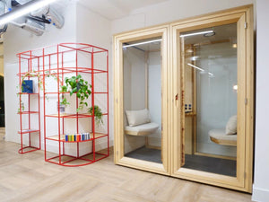Residence Meet Wooden Box Acoustic Meeting Pod with White Pillow and Seat Cushion and Red Metal Storage Outside