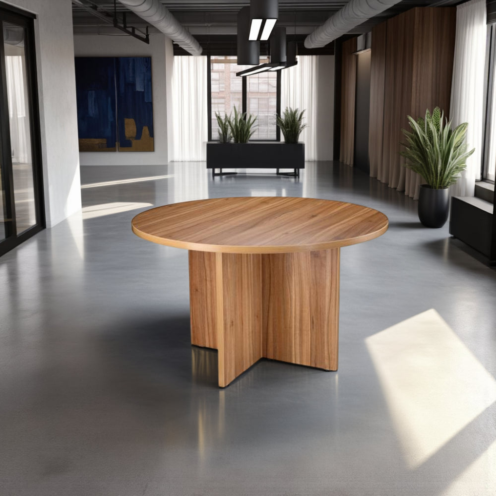 Round Wooden Meeting Table with Indoor Plant and Credenza Unit in Modern Office Setting