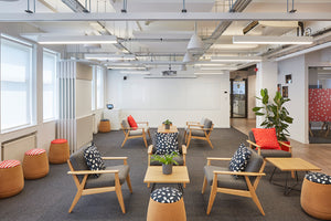 Scandi Upholstered Lounge Armchair With Coffee Table And Indoor Plant In Breakout Setting 2