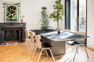 Shila A Frame Multitasking Chair with Upholstered Seat with Meeting Room Table and Indoor Plant in Modern Office Setting