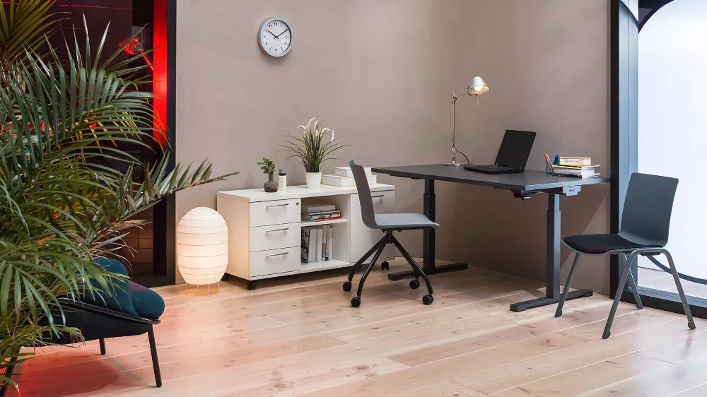 Shila Multitasking Chair with Trestle Base on Castors with Sit Stand Desk and Credenza Unit in Modern Office Setting