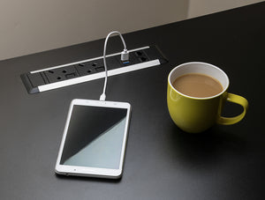 Slimline Omega 2 UK Sockets In Desk Power Module Black Attached in the Table