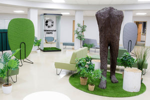Social Acoustic Single Swing with Modular Sofa and Indoor Plant in Breakout Setting