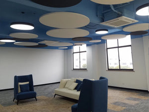 Soundtect Acoustic Circles Ceiling Panel In Reception Area With Couch And Sofa
