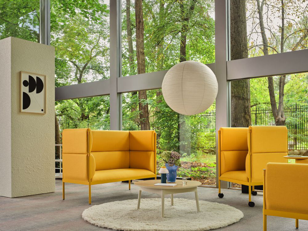 Stilt High Back Monochromatic Armchair with Sofa and Coffee Table in Reception Setting