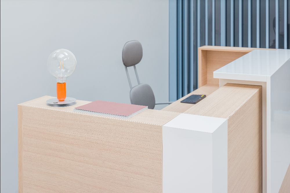 Tera Modular Reception Desk with High Back Office Chair in Reception Setting