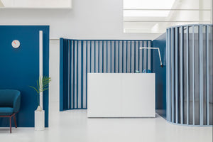 Tera Modular Reception Desk with Lounge Seating and Indoor Plant in Reception Setting
