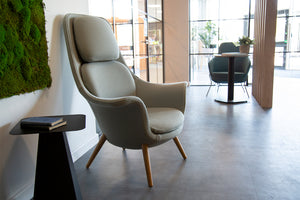 Trost Low Back Lounge Armchair In Grey Finish With Coffee Table In Breakout Setting