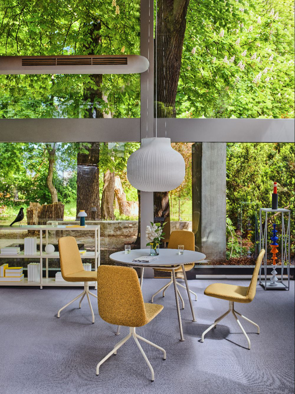 Ulti Office Chair on 4 Star Aluminium Base with Castors with Round Table and Bookshelves in Modern Office Setting