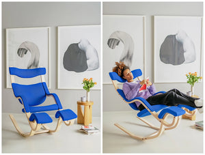 Varier Gravity Balans Zero Gravity Chair 10 In Blue With Small Wooden Side Table In Living Room Area