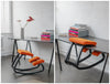 Varier Variable Kneeling Chair 12 In Orange Finish With Black Rectangular Table