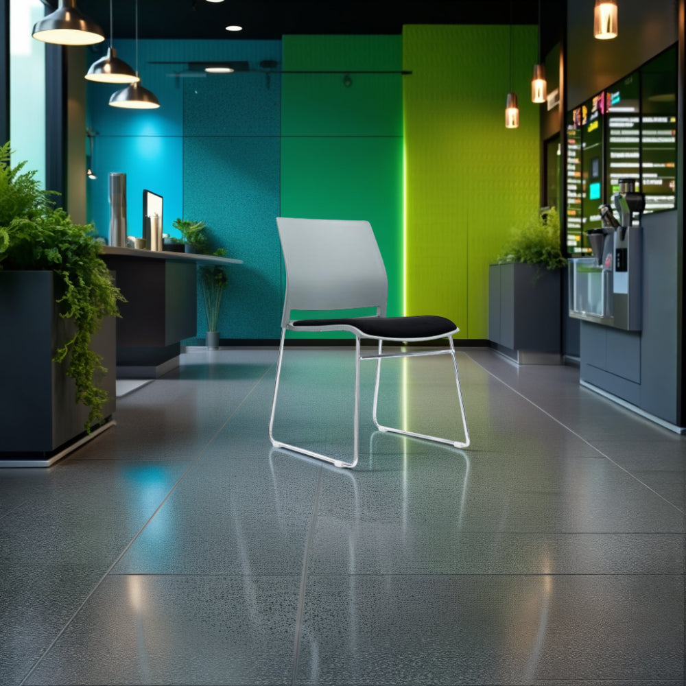 Verse Multipurpose Stackable Chair with Canteen Table and Indoor Plant in Breakout Setting