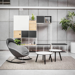 Vieni High Backrest Rocking Chair with Coffee Table and Shelves in Reception Setting
